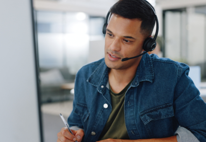 Man in headset, representing proactive vulnerable customer management for lenders and FinTechs by Lenvi.