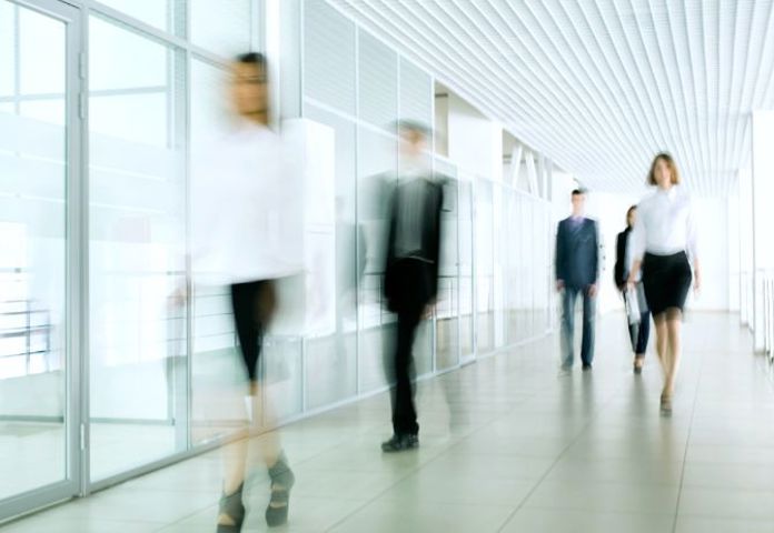 image of business men and women walking to represent Lenvi's FCA-accredited mortgage-and-loan-servicing services