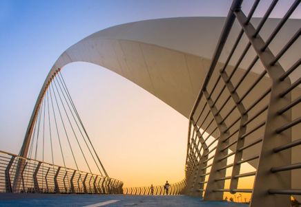 Modern arched bridge at sunset, symbolising FinTech Lenvi